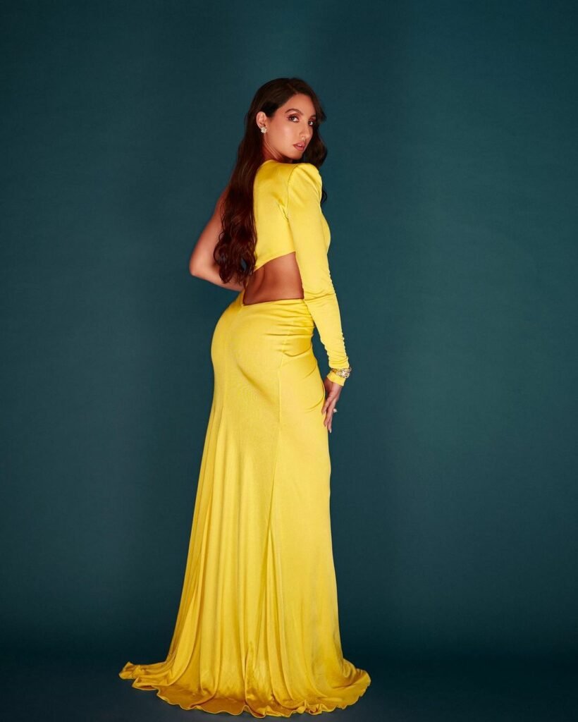 Nora Fatehi : కత్తిరించిన డ్రెస్లోనూ కత్తిలా కనిపిస్తున్న హాట్ బ్యూటీ 2 nora-fatehi-trending-glamours-cutout-yellow-dress