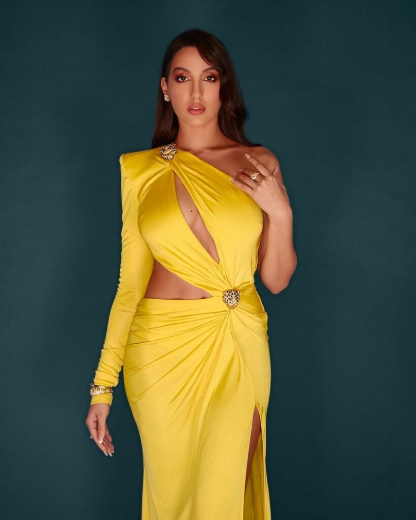 Nora Fatehi : కత్తిరించిన డ్రెస్లోనూ కత్తిలా కనిపిస్తున్న హాట్ బ్యూటీ nora-fatehi-trending-glamours-cutout-yellow-dress