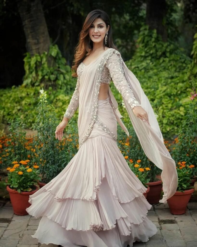 Rhea Chakraborty : చీరకట్టుతో చంపుతోన్న అందాల బొమ్మ...నడుము అందాలు చూడతరమా 2 rhea-chakraborty-share-stills-of-her-latest-photo-shoot-in-lehenga-style-ruffle-peach-saree